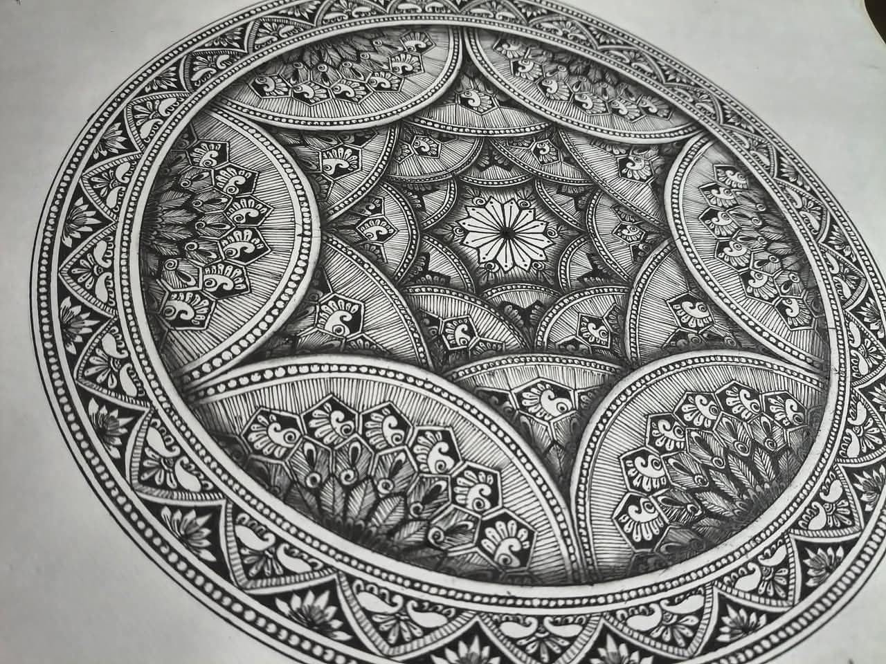 Detailed black and white pen mandala artwork