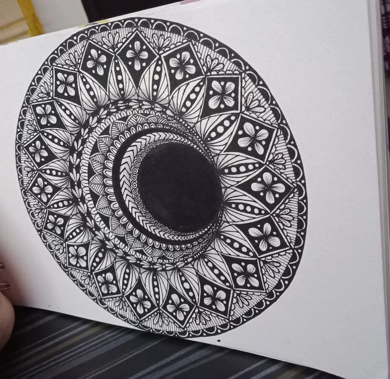 Circular black and white mandala artwork